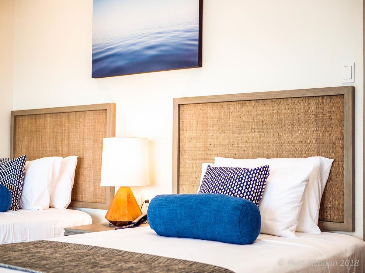 Huni Sicogon Hotel Carles Bagian luar foto